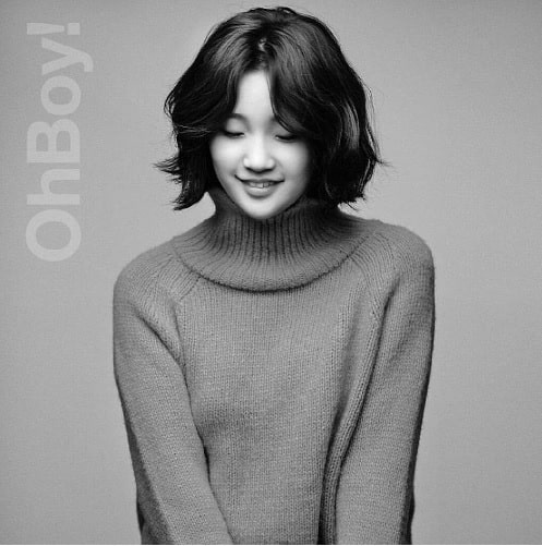 A black and white picture of Park So-dam smiling